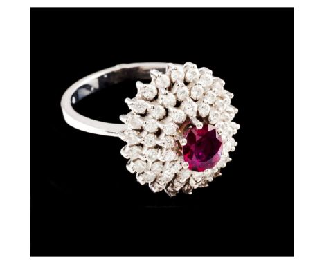 A ringWhite gold 800/000Set with 1 oval cut ruby and 54 8/8 cut diamonds totalling approximately 1 ct.Oporto hallmark (1938-1