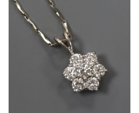A diamond cluster pendant, 18ct white gold setting on 18ct white gold suspension chain.