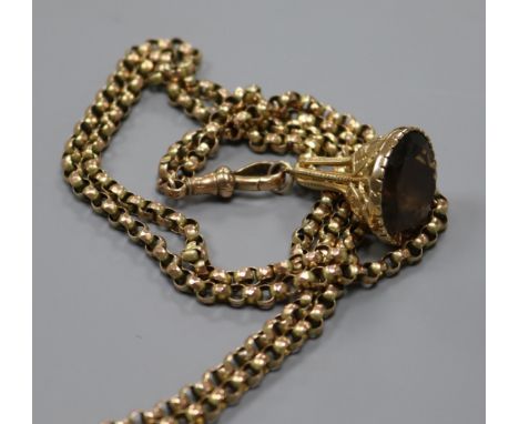 A Victorian 9ct gold guard chain hung with a yellow metal overlaid gem set fob seal, chain 150cm.