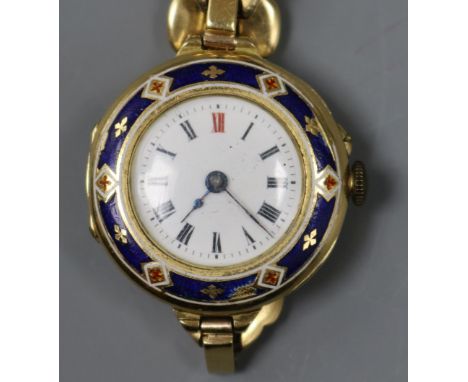 A lady's 18ct. gold and enamel wristwatch with 18ct expandable bracelet.