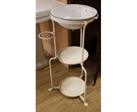 A late Victorian white enamelled wash basin, combined iron stand W.45cm