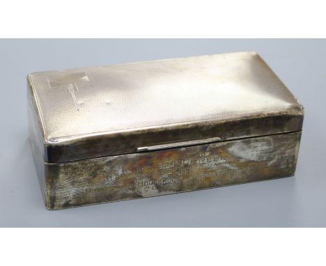 A 1930's Art Deco engine turned silver cigarette box, with presentation inscription, 17.9cm.