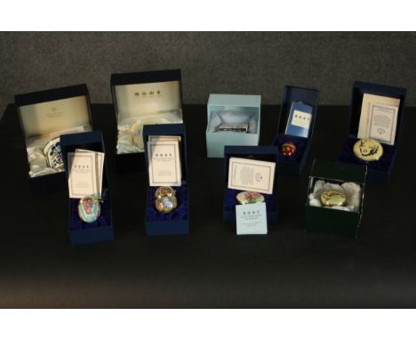 A collection of nine boxed Halcyon Days enamel and porcelain eggs, including Gold Marilyn 1962 limited edition numbered 162, 