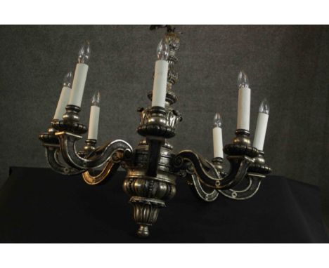 A silvered chandelier, the stem decorated with acanthus leaves with eight scrolling branches. H.80 Dia.78cm. 