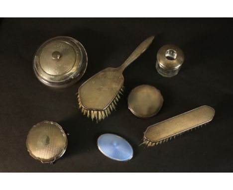 An engine turned decorated silver dressing table set (two brushes, pots and compact) and a guilloche blue enamel silver mirro