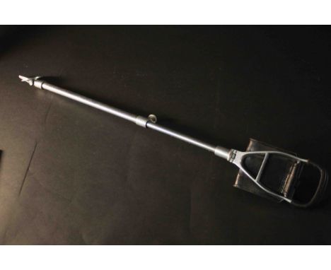 A vintage black leather and chrome shooting stick. L.90cm. 