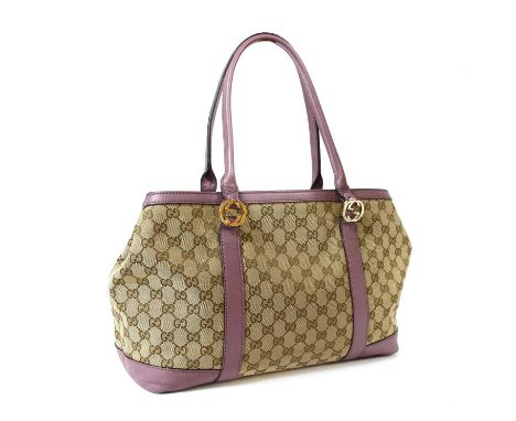 A Gucci beige monogrammed canvas medium 'Miss' tote, violet leather straps and detailing, gold-tone hardware, magnetic snap c