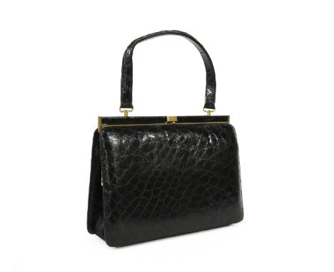 A vintage black crocodile leather handbag, gold-tone hardware, single flat handle, opening to beige suede interior, with zip 