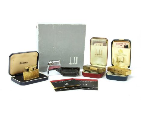 Two Dunhill lighters, with engine turned decoration, cased, a Ronson lighter, cased, and a Calibri lighter (4)