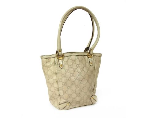 A Gucci ivory leather bucket bag, gold-tone hardware, dual rolled handles, stud detailing, interior with zip and slip pockets