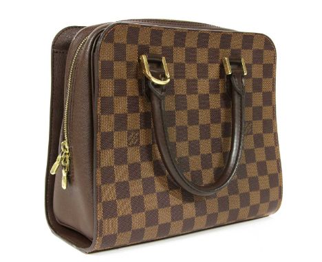 A Louis Vuitton monogrammed canvas 'Triana' handbag, brown leather dual rolled handles, gold-tone hardware, front flap pocket