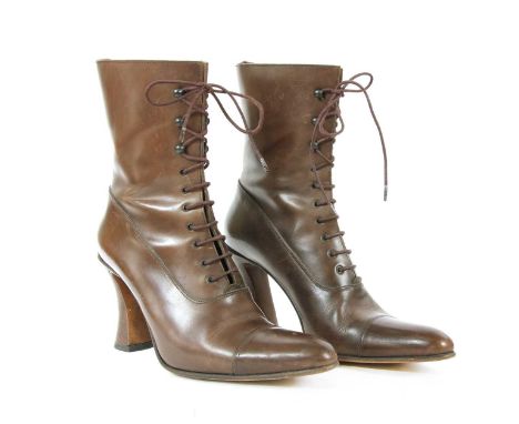 A pair of Michel Perry brown leather ankle boots, heel height 9.5cm, size 39½Condition report: Light marks, scuffs and scratc