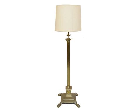 Brass column standard lamp on stepped base with lion's paw feet, 157cm high including shade.