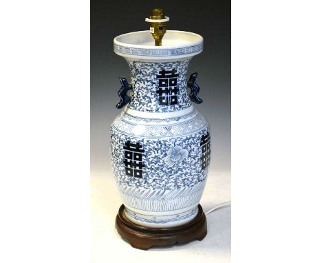 Chinese blue and white baluster table lamp of recent manufacture, raised on hardwood stand, 46cm high including fitment.