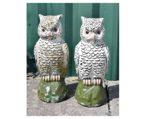 Pair of painted owl garden ornaments, 37cm high. 