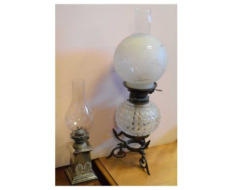 Late 19th/early 20th oil lamp with cut glass reservoir, together with another on a white metal base, 54cm high and smaller.