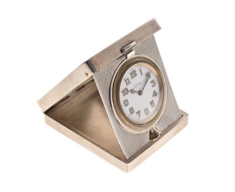 George V silver-cased boudoir timepiece, white Arabic dial marked '8 Days Swiss Made', crown below 6, in hinged engine-turned
