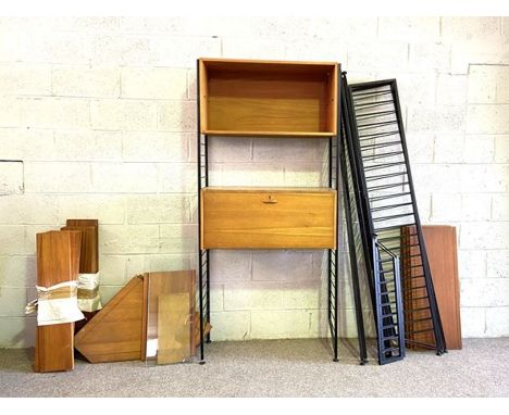 A highly adaptable vintage Ladderax shelving system, mid 20th century, with shelves, cabinets, corner sections and a glass fr