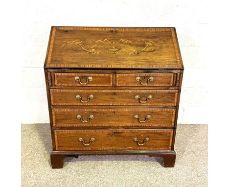 A George III style mahogany inlaid bureau, 19th century, with slope front, opening to fitted interior and over two short and 