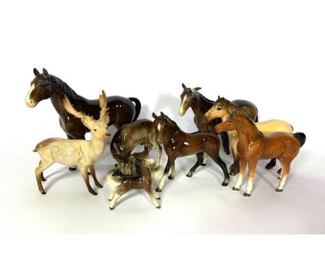 A selection of Beswick style decorative ceramic horses, and a fallow deer (a lot)