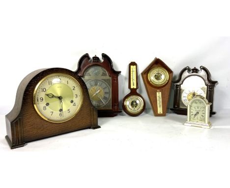 A late Victorian oak cased aneroid barometer/ thermometer, 81cm high; together with small group of assorted modern mantel clo
