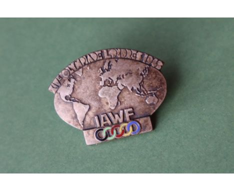 A XIVE OLYMPIADE LONDRES 1948 IAWF Olympic Games pin badge in the form of the world with enamelled Olympic Rings, marked to t