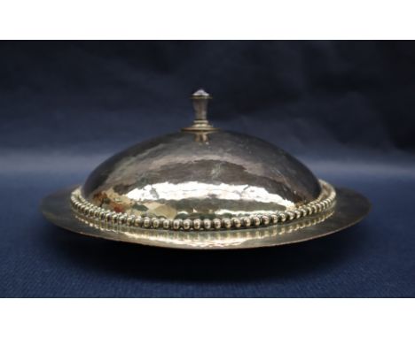 William Mark (1868-1956) - An early 20th Century Arts and Crafts silvered coppermuffin dish and cover, the enamelled finial a