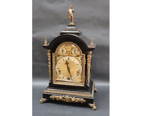 A 19th century ebonised and gilt decorated bracket clock, with a Mars figural surmount, flame finials, and scrolling feet, th