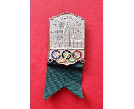 A 1948 London Olympic Games lapel badge,of rectangular form with the Houses of Parliament decoration above the Olympic rings 