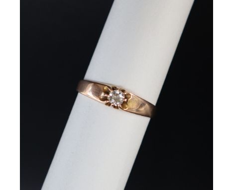 A solitaire diamond ring set with a round old cut diamond approximately 0.10cts to a 14ct yellow gold setting and shank, size