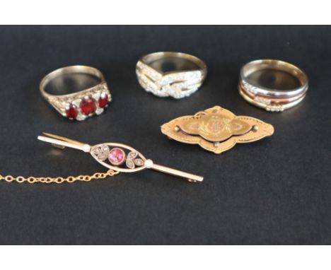 A 9ct gold three stone garnet set ring, size S together with a three colour 9ct gold diamond set ring, size T and a 9ct gold 
