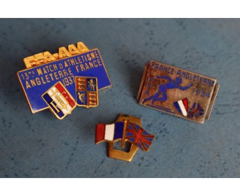 A 1934 Fédération Française d'Athlétisme enamel pin badge of rectangular form depicting a runner and flag shields FFA FRANCE 