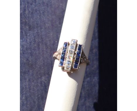 An Art Deco sapphire and diamond ring, set with a central row of six princess cut diamonds and two rows of five princess cut 