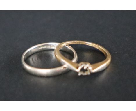 An 18ct white gold wedding band, size Q together with another 18ct gold ring, size O approximately 5 grams