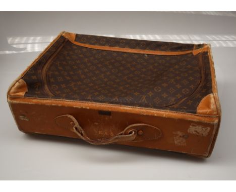 A Louis Vuitton suitcase with zip to the side panel, 56.5cm wide 