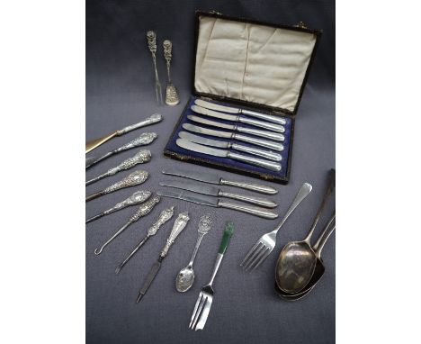 A set of three George IV silver table spoons, London, 1828, William Seaman, together with a silver fork, silver handled knive