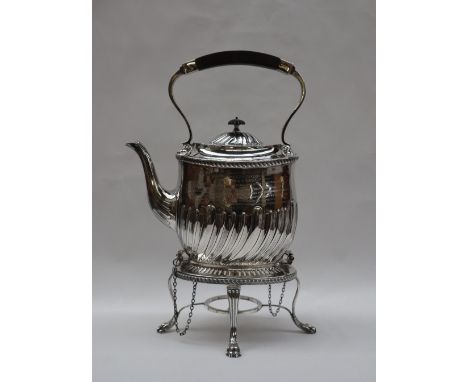 An Edward VII silver kettle on stand of oval form with a wave decorated body on a pierced base and four lions paw feet, Londo