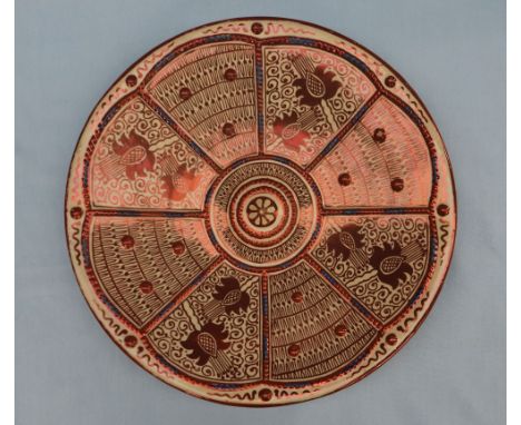 An Hispano Moresque type lustre charger with eight segments of flowerheads and leaves with a domed centre, 40cm diameter COND