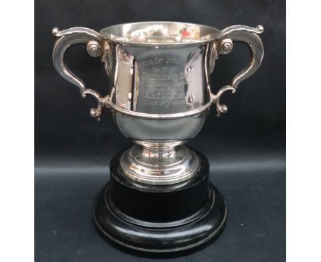 A George V twin handled silver trophy cup, inscribed “Cowbridge Fat Stock Show…” hallmarked for Birmingham, 1935, Adie Brothe