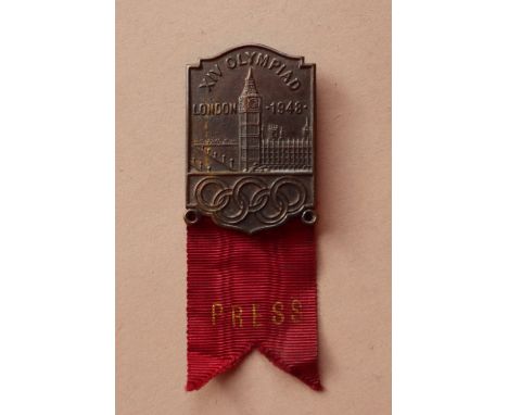 A 1948 London Olympic Games lapel badge,of rectangular form with the Houses of Parliament decoration above the Olympic rings 