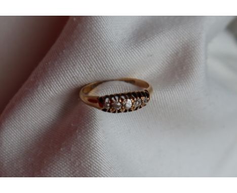 A five stone diamond ring with graduating old round cut diamonds to an 18ct yellow gold setting and shank, size P, approximat