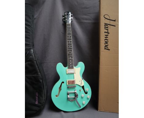 A Hartwood Revival Vibrato Semi Acoustic Guitar, styled after Gibson 335, in jade green featuring the vibrato vintage style t