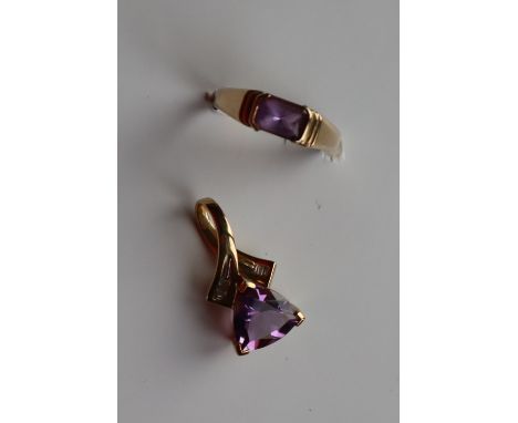 A 9ct gold amethyst and diamond pendant, set with a triangular amethyst and baguette cut diamonds to a 9ct gold setting and s