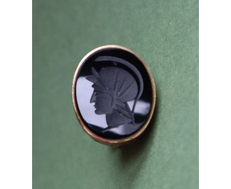 A 9ct gold fob seal with lion surmount, the oval hard stone panel intaglio carved with a portrait in profile, approximately 9