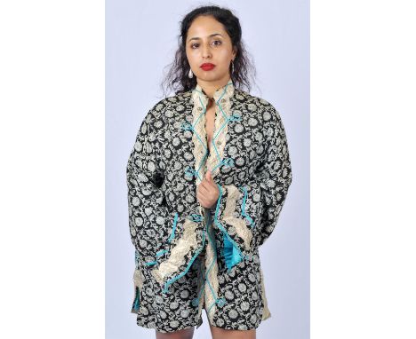 THEA PORTER A mid 1960s an iconic original men's black embroidered kaftan with metallic thread and turquoise silky lining and