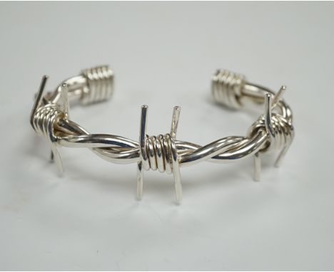 A modern silver 'barbed wire' open bangle, by M. Marlow, Edinburgh, 2006, overall width 83mm, 74 grams.