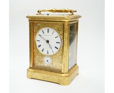 A late 19th century engraved brass cased repeating alarm carriage clock, with Russian retailer, height 13cm. Dials good; case