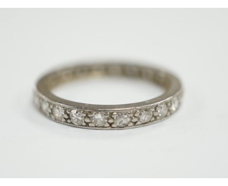 A white metal and diamond set full eternity ring, size M, gross weight 2.9 grams.