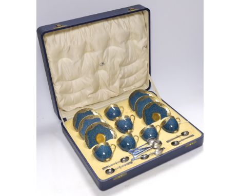 A cased Royal Worcester gilt and powder blue six piece coffee set with silver teaspoons, set of six silver and guilloche enam