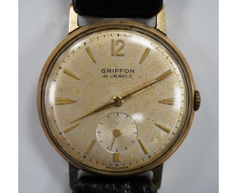 A gentleman's Swiss 9ct gold Griffon manual wind wrist watch, on a leather strap.